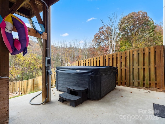 view of patio with a hot tub