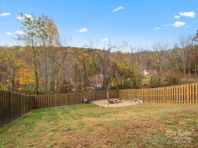 view of yard with an outdoor fire pit