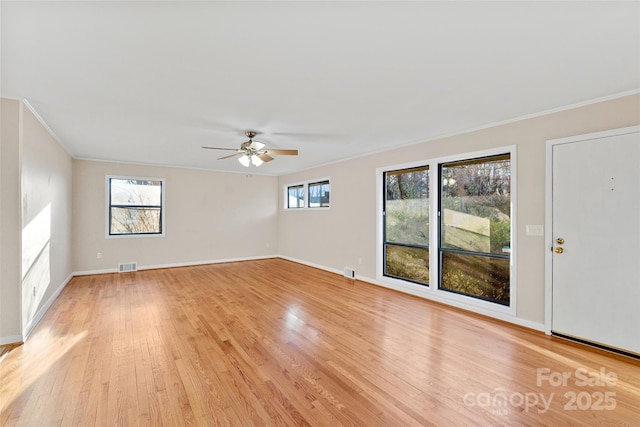 unfurnished room with light wood-type flooring, ceiling fan, and ornamental molding