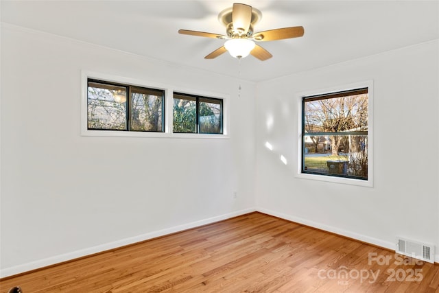 unfurnished room featuring light hardwood / wood-style floors and ceiling fan