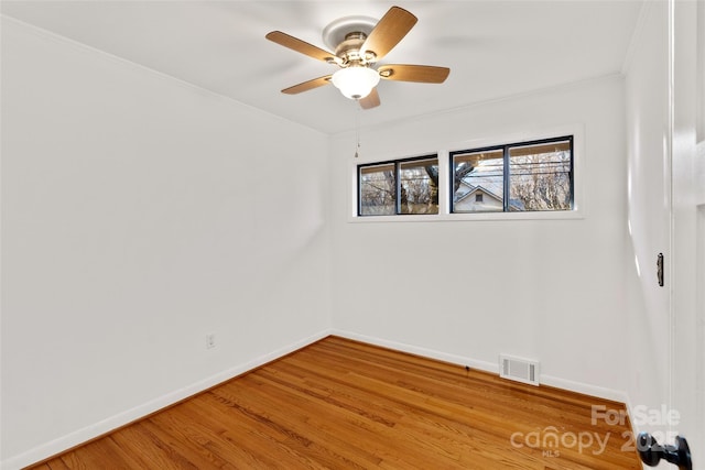 empty room with hardwood / wood-style flooring and ceiling fan