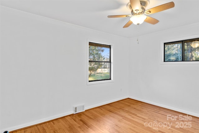 unfurnished room with ceiling fan and wood-type flooring