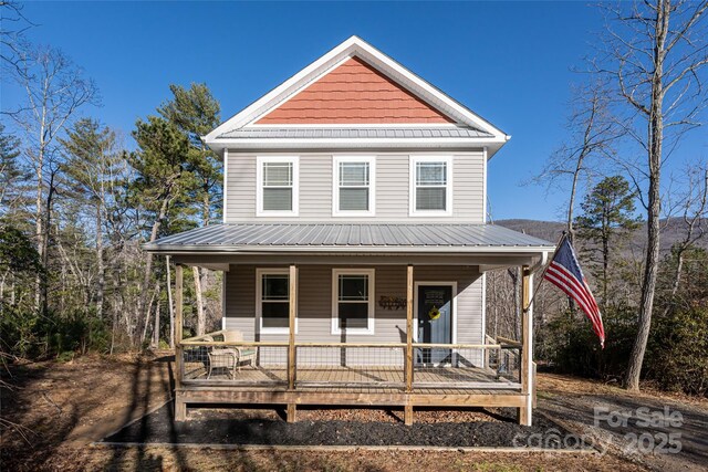 farmhouse featuring covered porch