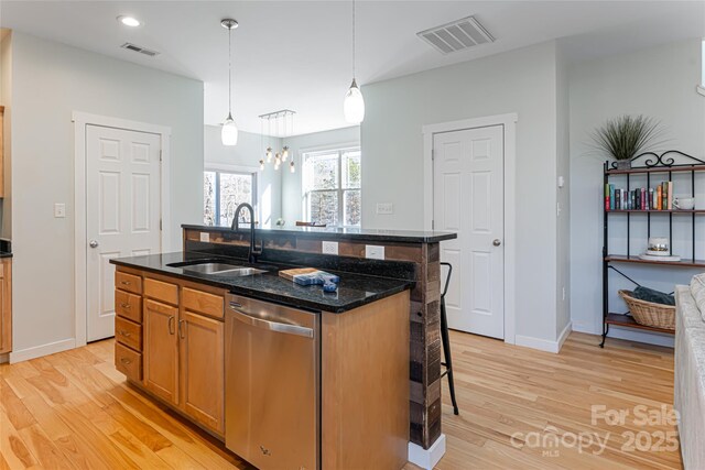 7 Pineview Rd, Fairview, NC 28730 - kitchen with dishwasher, a sink, light wood-style flooring, a breakfast bar area, and recessed lighting