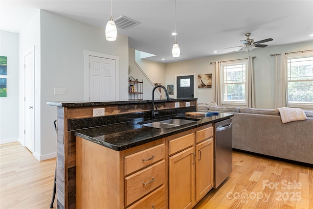 7 Pineview Rd, Fairview, NC 28730 - kitchen featuring a sink, stainless steel dishwasher, light wood-style floors, open floor plan, and a kitchen island with sink