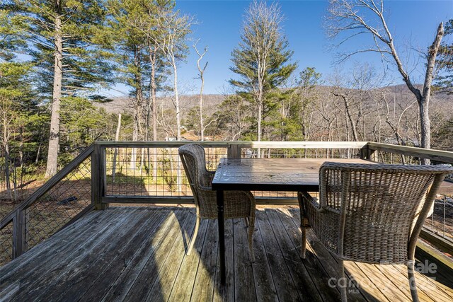 7 Pineview Rd, Fairview, NC 28730 - wooden deck with outdoor dining space and a mountain view