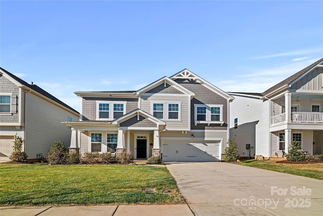 view of front of house featuring a front lawn and a garage