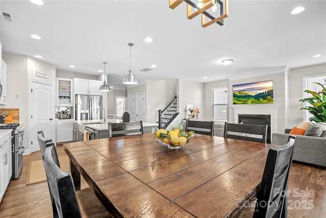 dining space with light hardwood / wood-style flooring