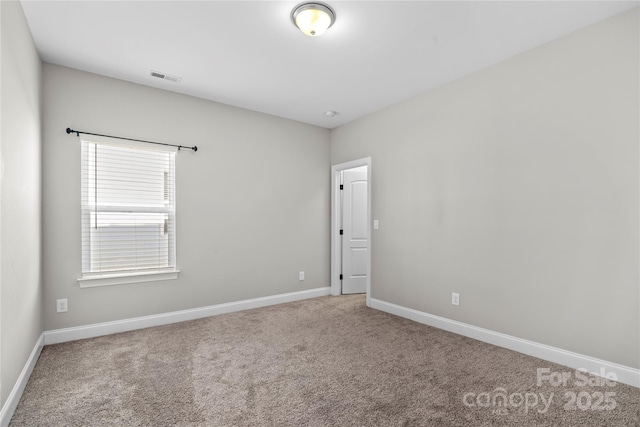 empty room featuring carpet floors