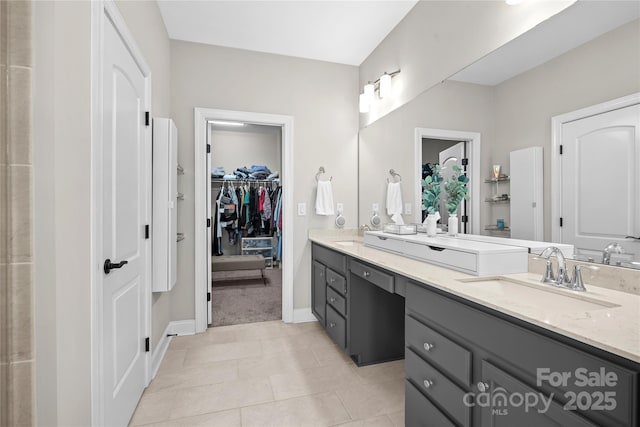 bathroom with tile patterned flooring and vanity