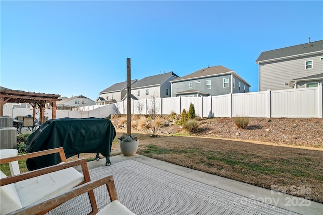 view of patio featuring a pergola, central AC unit, and a grill