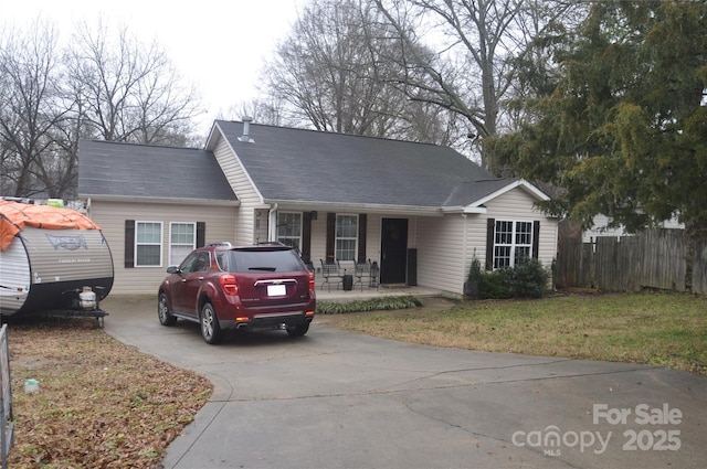 ranch-style house with a front yard