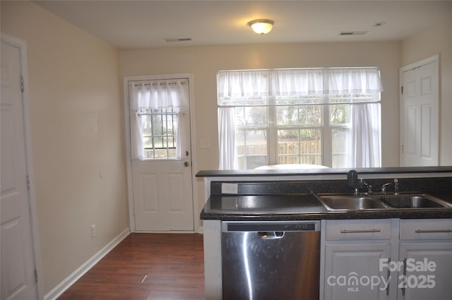 kitchen with dishwasher, white cabinets, dark wood-type flooring, and sink