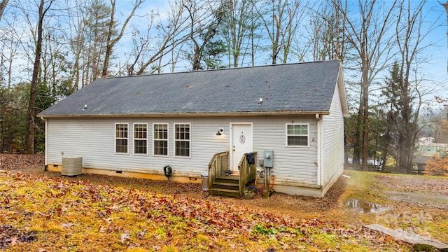 back of house featuring cooling unit