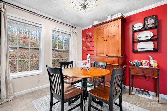 tiled dining area with a textured ceiling, a notable chandelier, crown molding, and a wealth of natural light