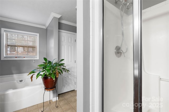 bathroom featuring tile patterned floors, ornamental molding, a textured ceiling, and shower with separate bathtub