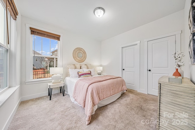 bedroom with light carpet