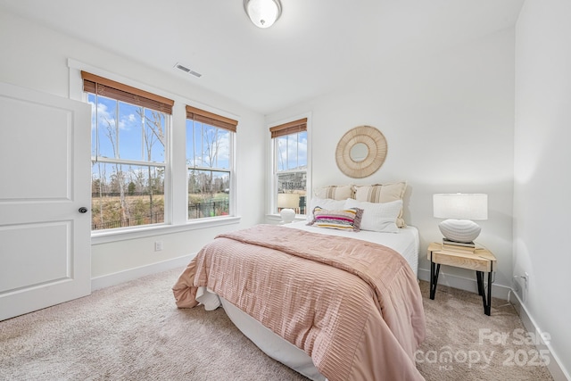 bedroom with light colored carpet