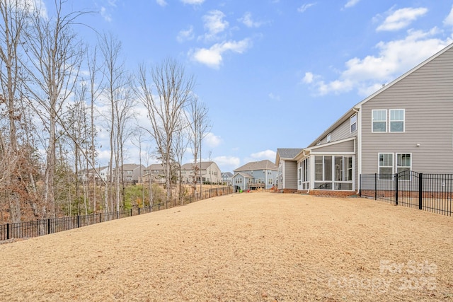 view of yard with a sunroom