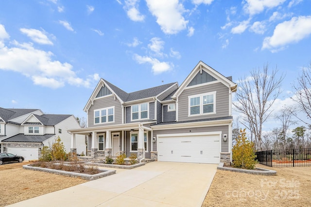 craftsman inspired home featuring a porch and a garage