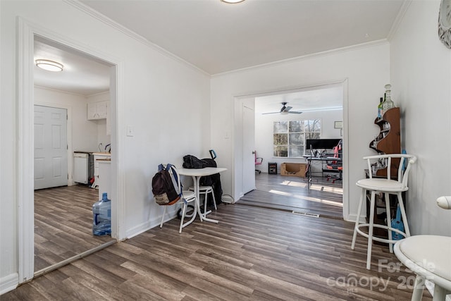 interior space featuring ornamental molding and hardwood / wood-style flooring