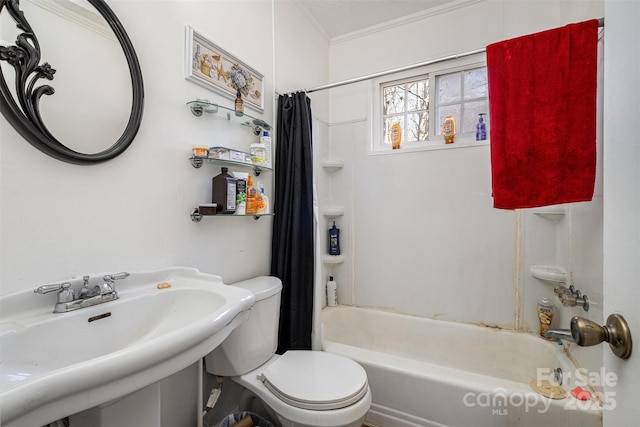 full bathroom featuring toilet, shower / tub combo with curtain, ornamental molding, and sink