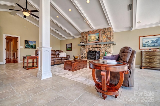 living room featuring high vaulted ceiling, ceiling fan, a fireplace, beam ceiling, and decorative columns