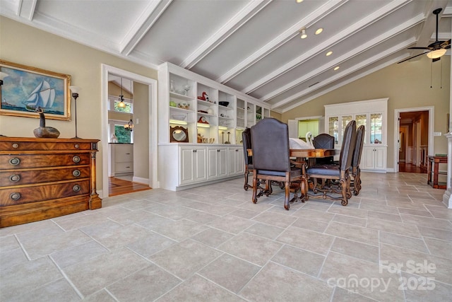 dining space featuring ceiling fan and lofted ceiling with beams