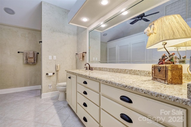 bathroom with tile patterned floors, ceiling fan, vanity, and toilet