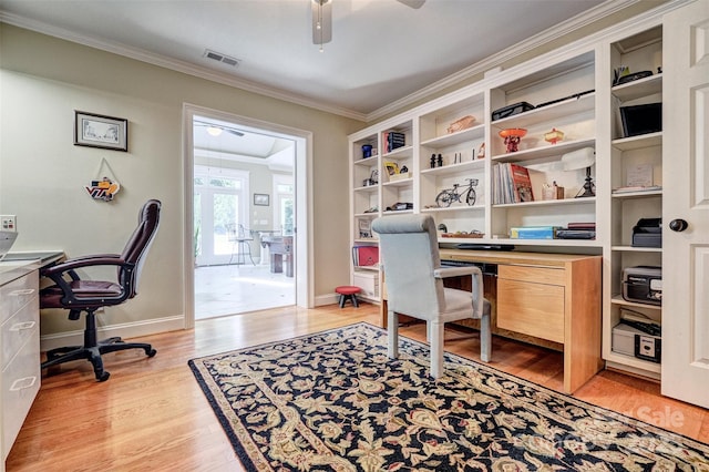 home office featuring light hardwood / wood-style flooring, ceiling fan, and crown molding