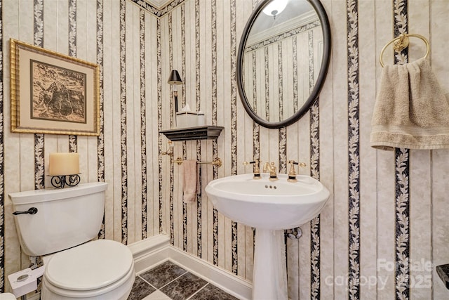 bathroom featuring tile patterned floors and toilet