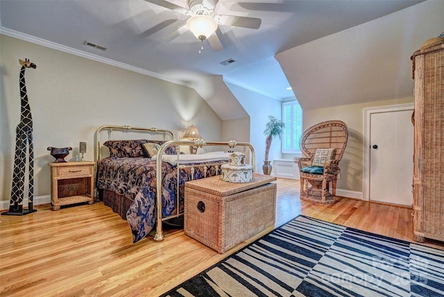 bedroom with light wood-type flooring, ceiling fan, and ornamental molding