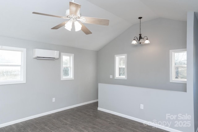 spare room with lofted ceiling, ceiling fan with notable chandelier, a wall mounted air conditioner, and dark hardwood / wood-style floors