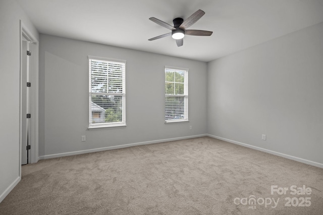 carpeted empty room with ceiling fan