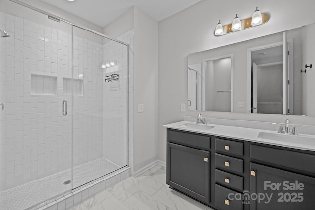 bathroom with a shower with door and vanity