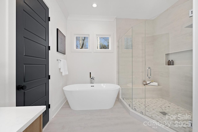 bathroom featuring separate shower and tub and ornamental molding