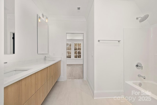 bathroom with vanity and tub / shower combination