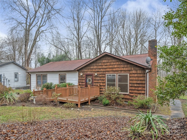 view of front facade with a wooden deck