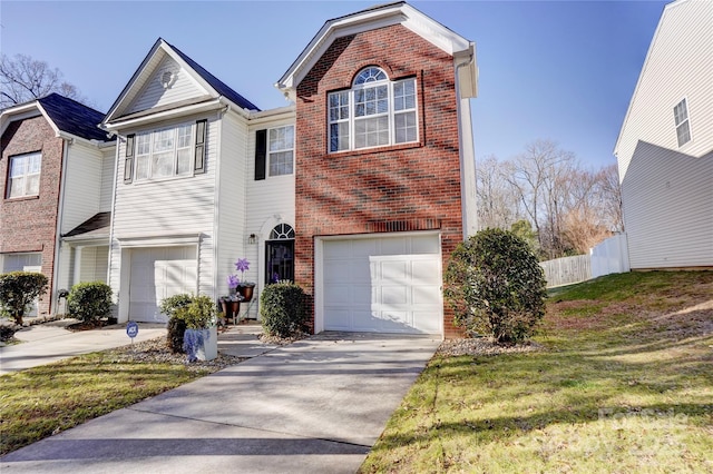 view of front of property featuring a front yard and a garage