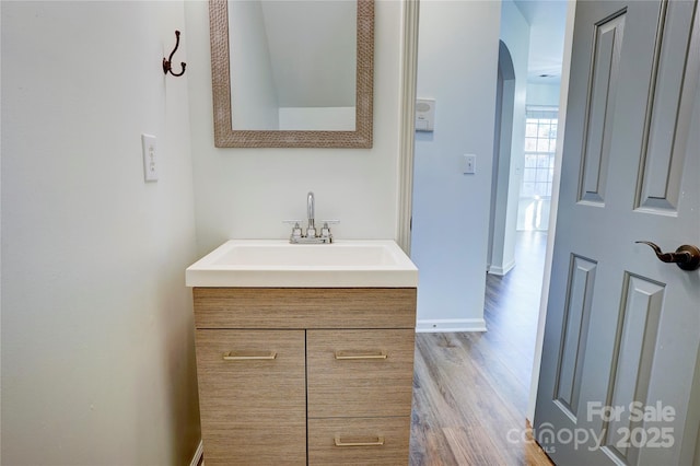 bathroom featuring vanity and wood-type flooring