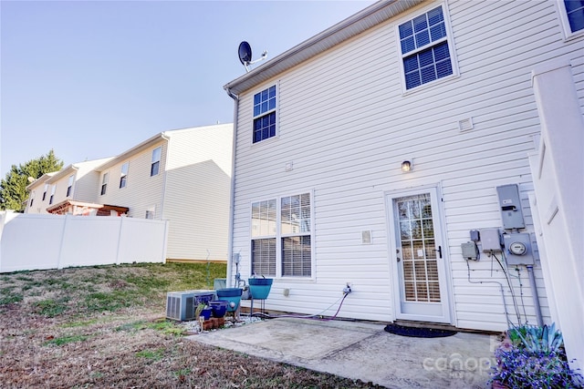 rear view of house featuring a patio and central air condition unit