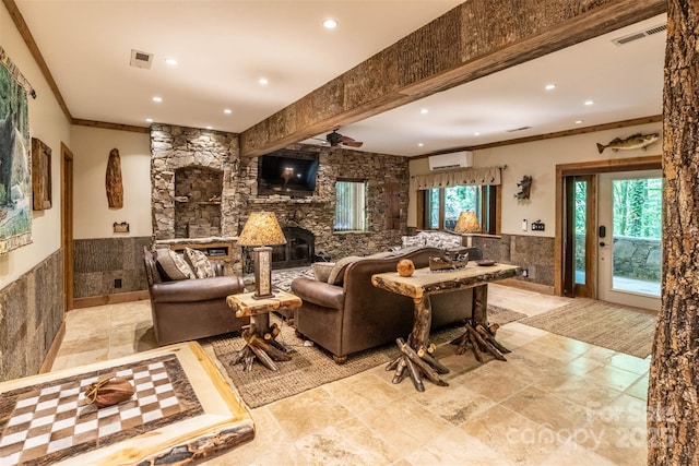 living room featuring a wall mounted air conditioner, a fireplace, ceiling fan, and crown molding