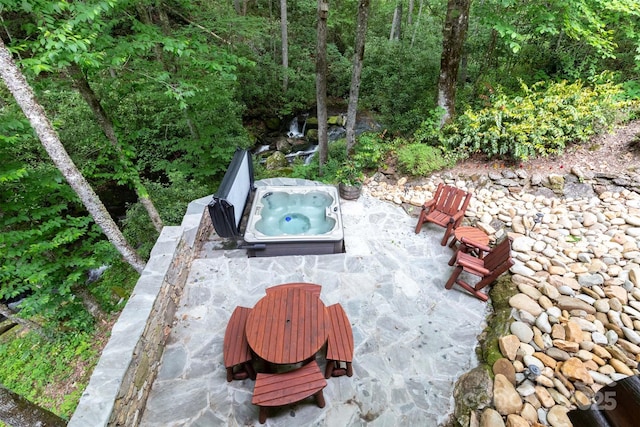 view of patio featuring an outdoor hot tub