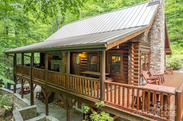 wooden terrace featuring a patio area