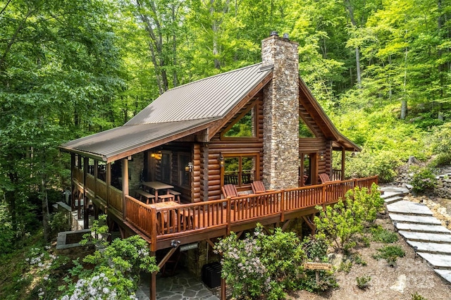 rear view of house featuring a deck