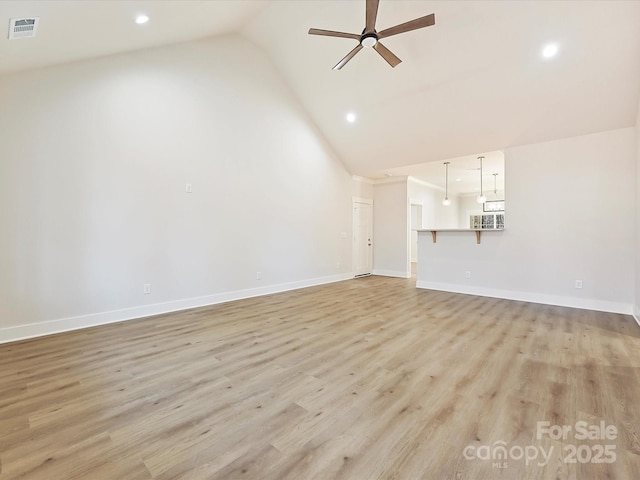 unfurnished living room featuring ceiling fan, light wood-type flooring, and lofted ceiling