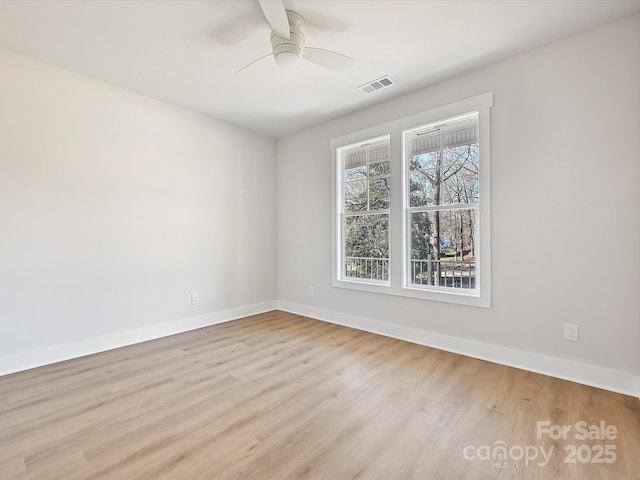 spare room with ceiling fan and light hardwood / wood-style floors