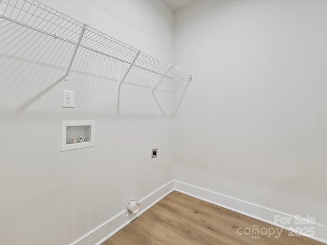 laundry area with washer hookup, wood-type flooring, and electric dryer hookup