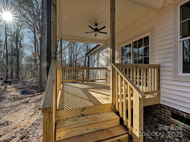 wooden terrace featuring ceiling fan