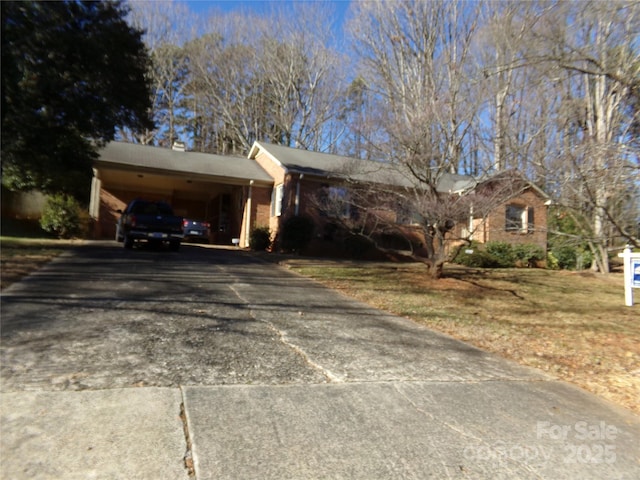 view of front of property with a carport